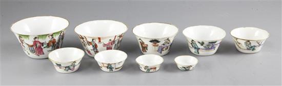 A set of nine Chinese famille rose nesting cups, Daoguang period, graduating from 4.1cm to 11cm, largest cup with rim chip and short ha